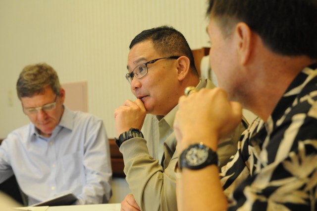 Commanding Officer of the Singapore Armed Forces speaks to a small group