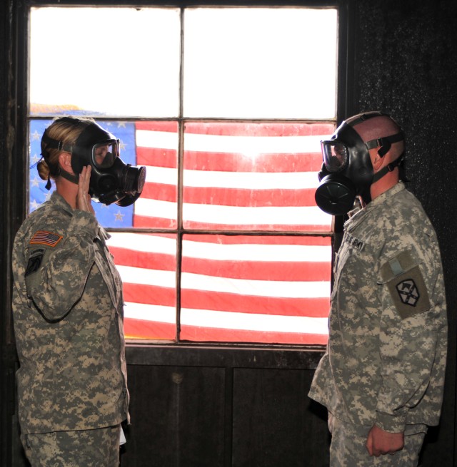 Soldier reenlists inside gas chamber