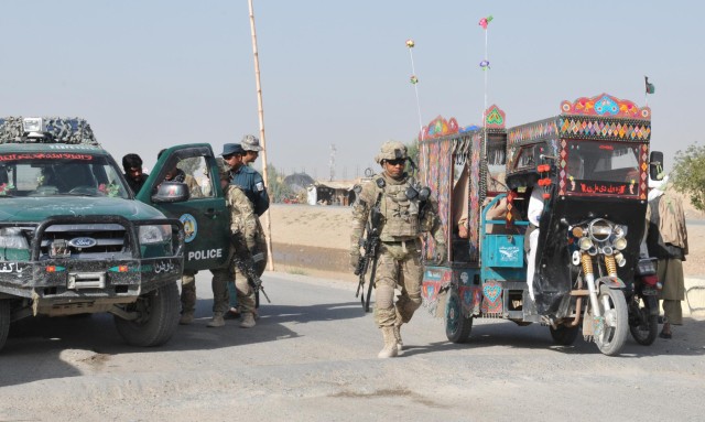 Afghan, ISAF police disrupt narcotics smuggling with help from hounds