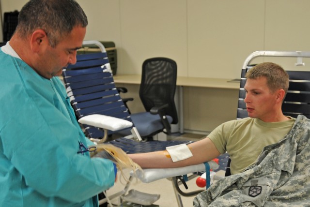 Soldiers give life at Armed Services blood drive, 15th Sustainment Brigade