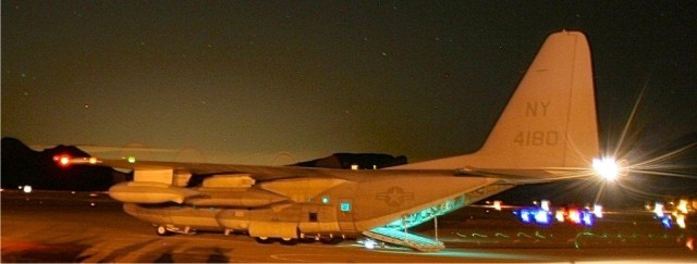 A C-130 Hercules is readied for hot-pit refueling during the Marine invasion exercise at Fort Huachuca's Libby Airfield.