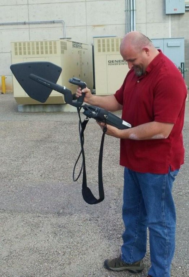 Jon Kringen, the installation spectrum manager, uses a PR-100 to locate a frequency that Network Enterprise Center officials believe is being used without authorization.