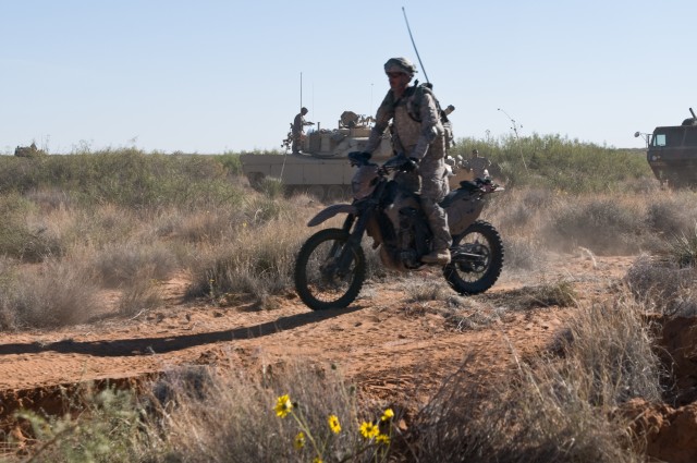 Iron Brigade soldiers combine dirt bikes, ATVs with tanks