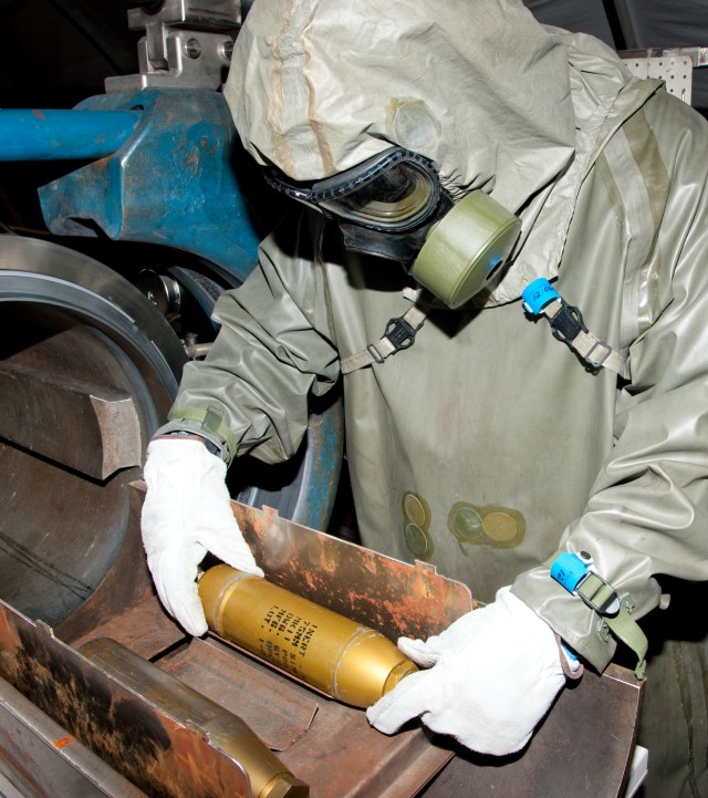 A CBARR EDS operator secures a chemical munition