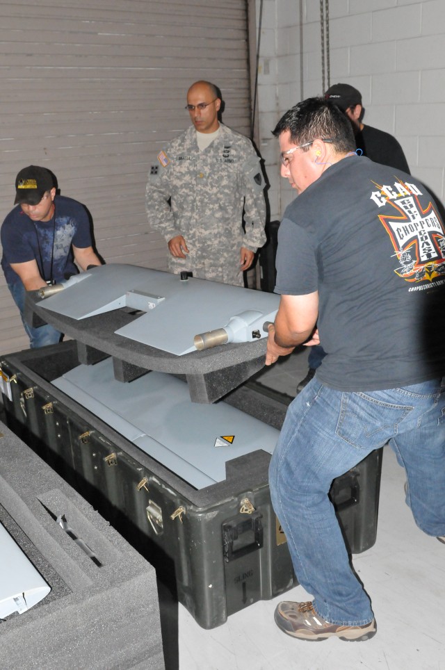 CCAD artisans unpack the first UAS Shadow received at the depot.