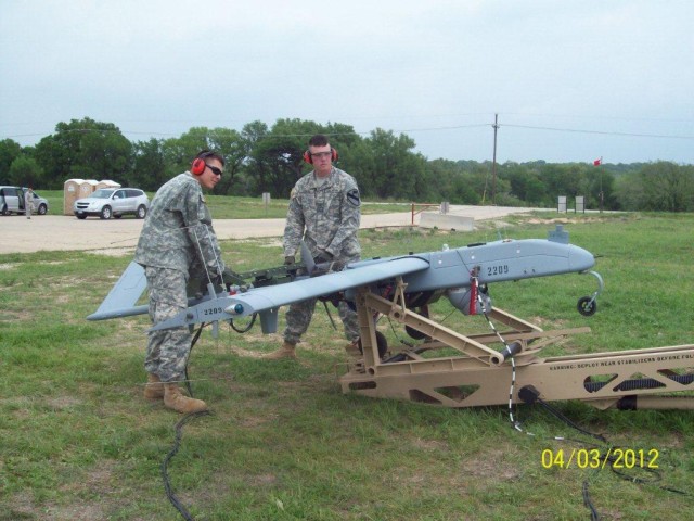 Military personnel at Fort Hood Army base work with the UAS Shadow