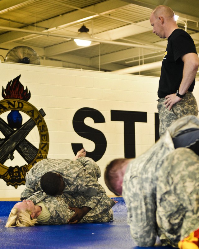 ASC Soldiers roll out mats to roll up the enemy