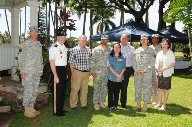 USARPAC Deputy Commanding general poses with USARPAC Fiscal Triad members