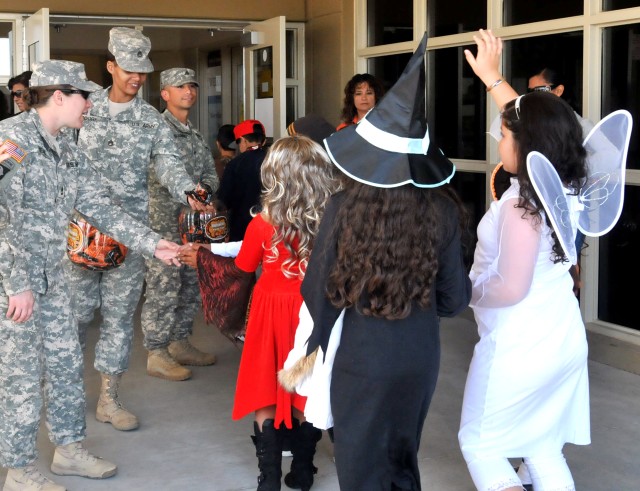 402nd FA Soldiers march in adopted school's Halloween Parade