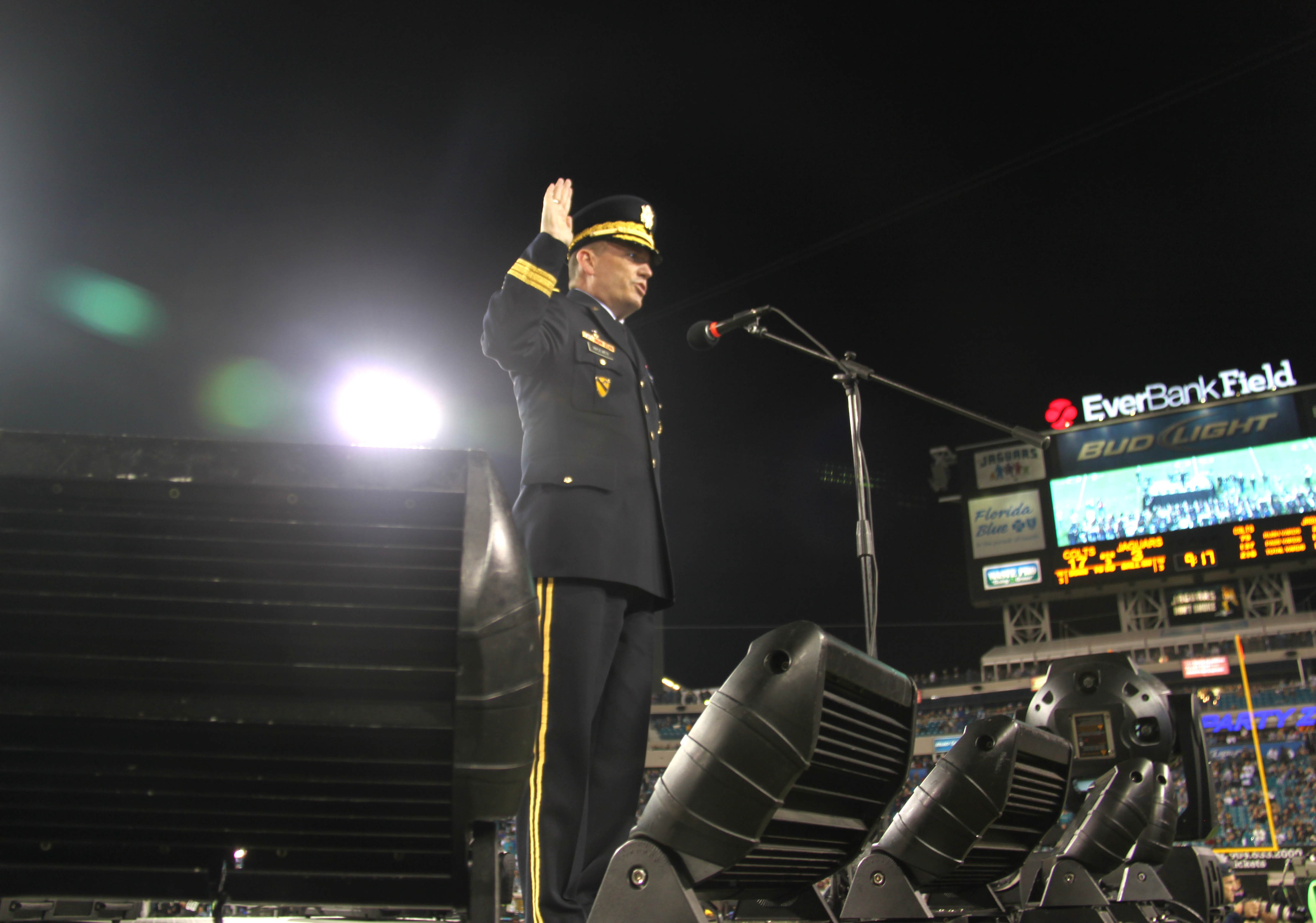 U.S. Military recruits are sworn in during halftime on Salute to Service  military appreciation day at an NFL football game between the Jacksonville  Jaguars and the Las Vegas Raiders, Sunday, Nov. 6