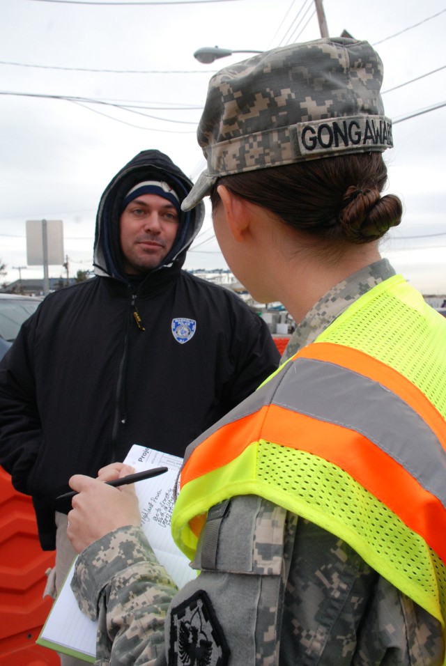 1st Lt. Andrea Gongaware, 554th Engineer Battalion, speaks with local officials Nov. 8 in Highlands, N.J.