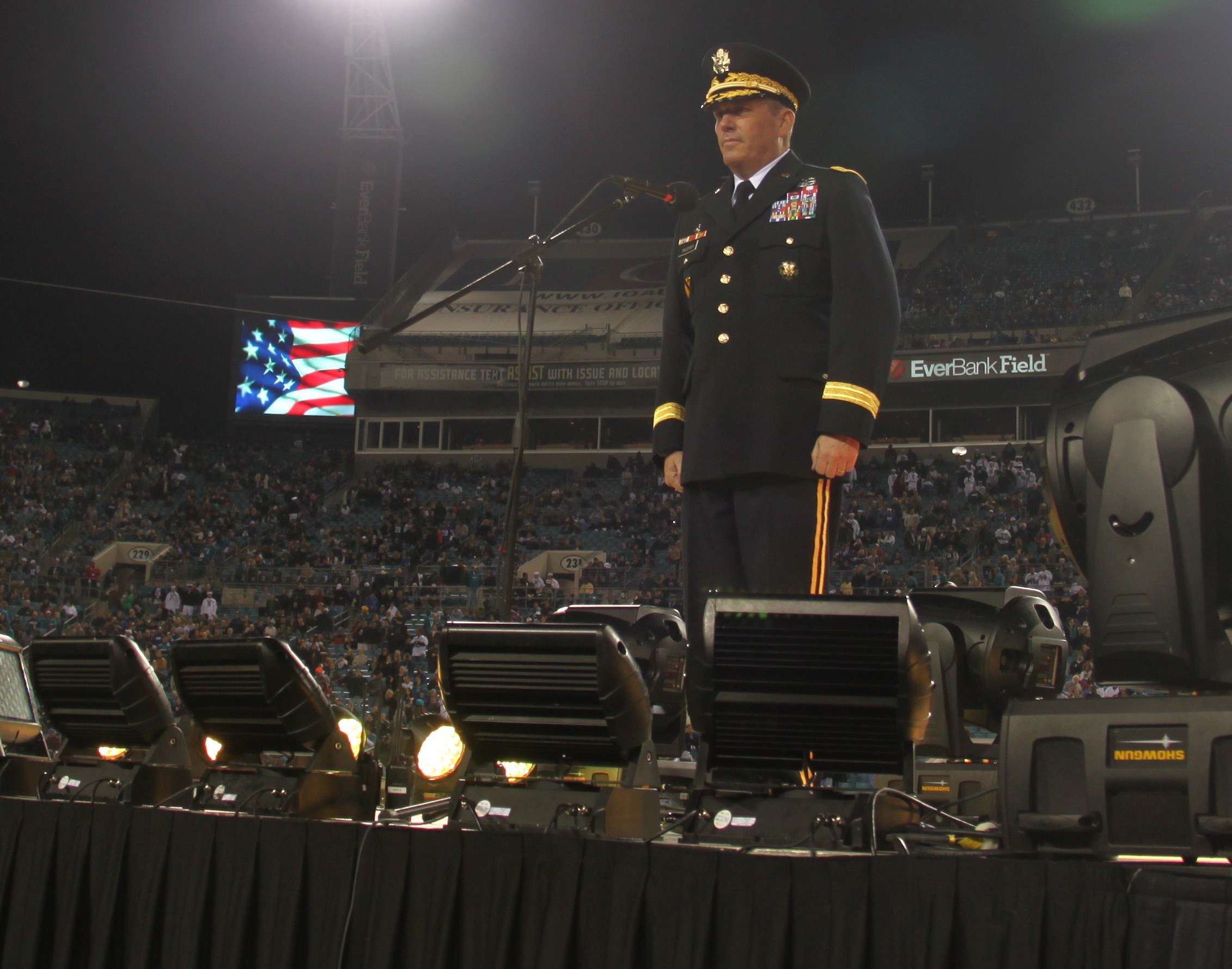 U.S. Military recruits are sworn in during halftime on Salute to