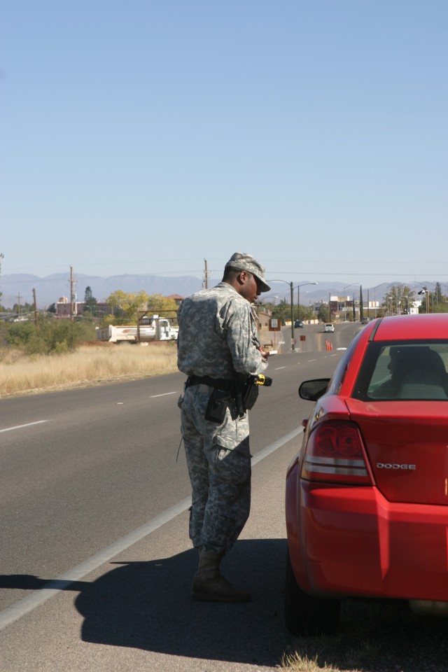 Spc. Daniel Willis, 18th MP Detachment, stops a vehicle for speeding during a routine traffic stop on Fort Huachuca. 