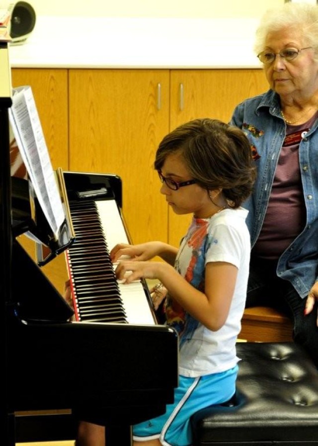Isabelle Mitchell practices her piano skills for the upcoming holiday season under the observation of her teacher Ruth Coulter. Piano classes are offered Wednesdays through Fridays. To register, call