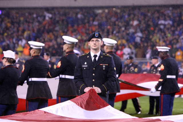 100 service-member flag unfurling at Soldier Field