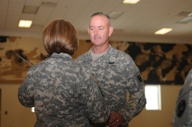 Sgt. Maj. Nickolette Yungandreas hands 800th LSB senior NCO duties to Command Sgt. Maj. Jeffrey Darlington