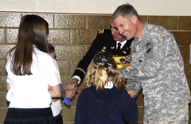 Daughters present fathers with gift basket on Veterans Day