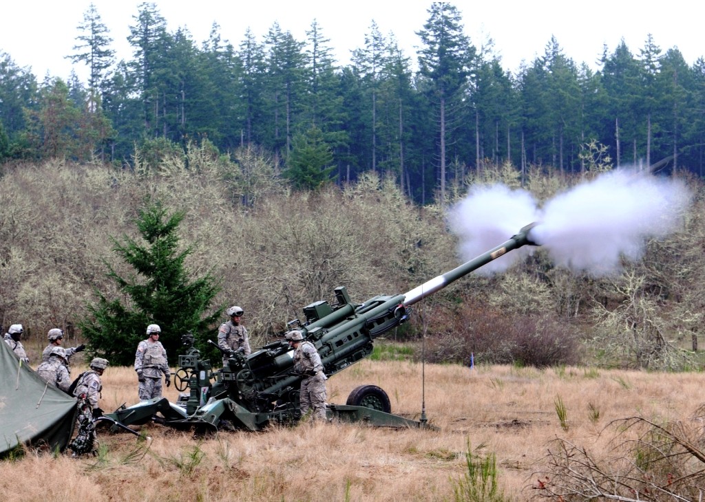 Local community leaders observe field artillery demonstrations ...