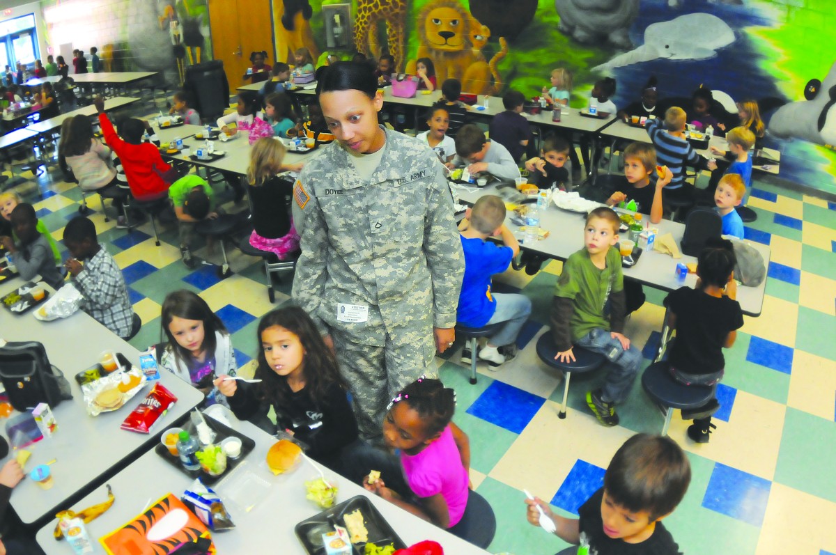 Young Soldier Uses Uniform Enthusiasm To Connect With Local School 