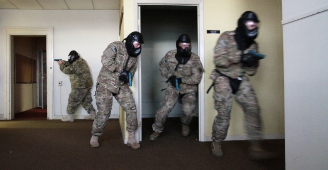 Members of the 2nd Brigade Combat Team search for an active shooter threat
