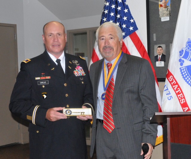 Colonel Christopher B. Carlile, Corpus Christi Army Depot Commander (CCAD), stands beside the outgoing Mayor of Corpus Christi Joe Adame during a special award presentation 