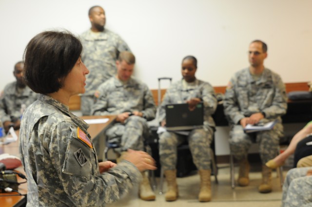Commanding General for Army Contracting Command speaks with exercise  participants