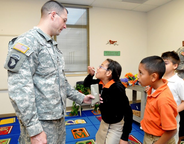 402nd FA Soldiers share Meals Ready to Eat with Partners in Education students 