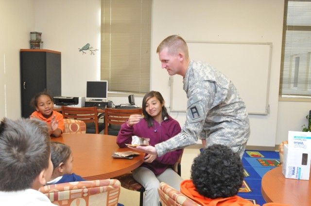 402nd FA Soldiers share Meals Ready to Eat with Partners in Education students 