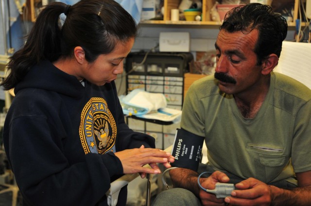 Afghan policeman helped by SFAT, FST