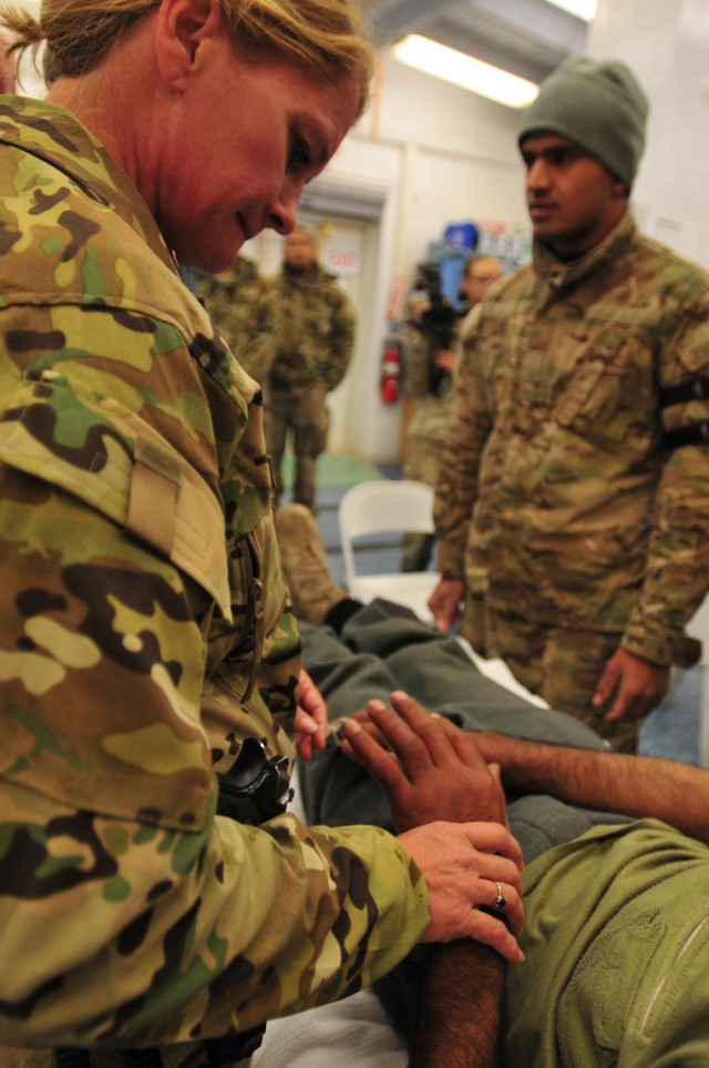 Afghan policeman helped by SFAT, FST