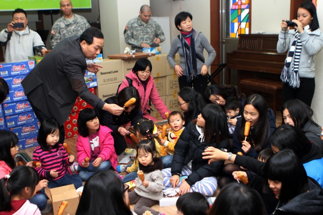 Army brings toys, food to local orphans