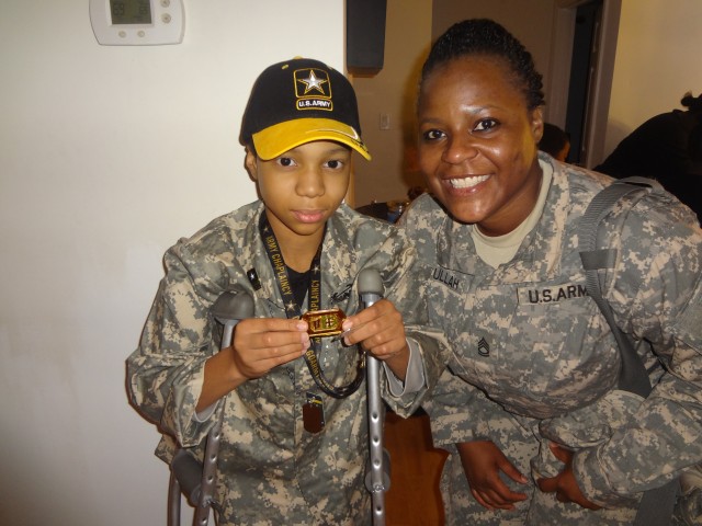 Khalil Quarles shows of his Army Medical Command coin