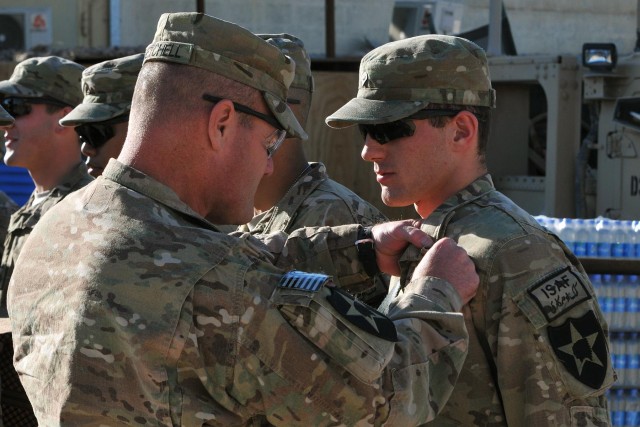 Field artillery soldiers receive CABs, medic receives CMB