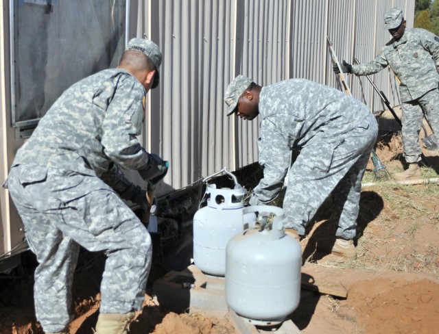 Soldiers fixing up the house
