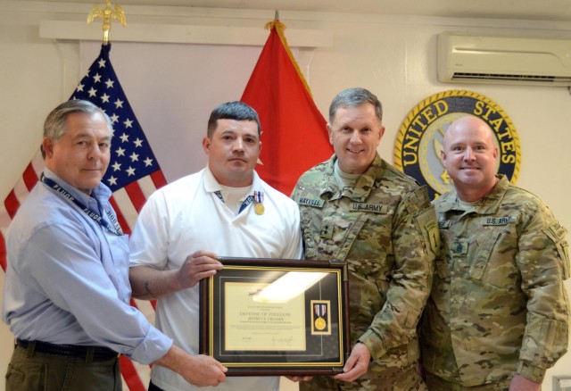 Injured contractor receives medal