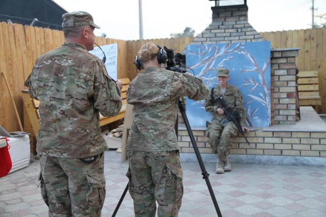 CSM Thomas Moore assists soldier