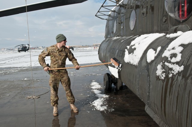 Wings of Destiny clean up after snow storm