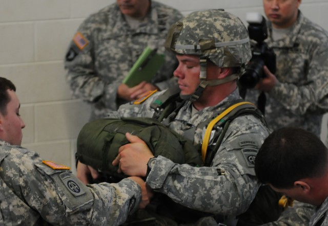 Paratrooper demonstrates equipment