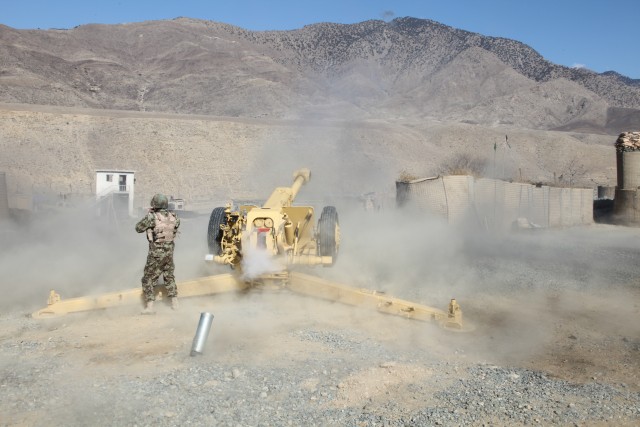Afghan soldier fires D-30