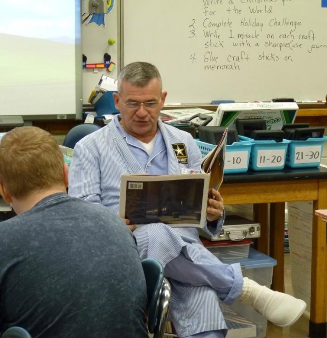 USAASB Commander reads to students