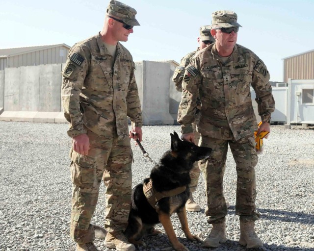 Military Working Dog handler re-enlists