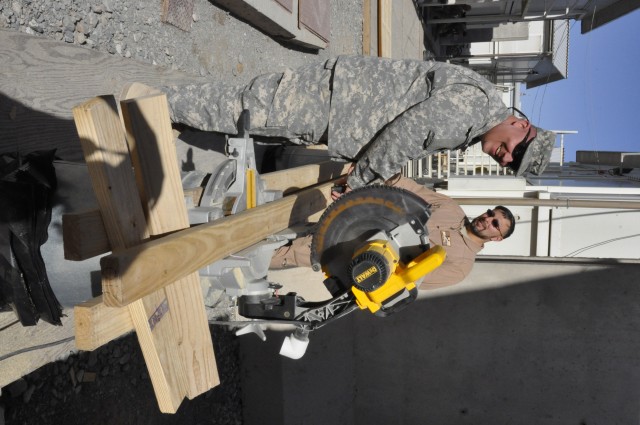 USACE volunteers build walkway; make moving around easier for Wounded Warriors at KAF