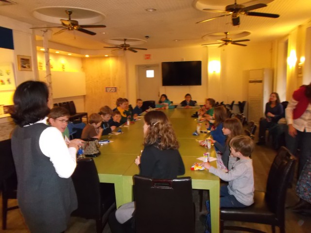 Home school students build jigsaw puzzles, friendships
