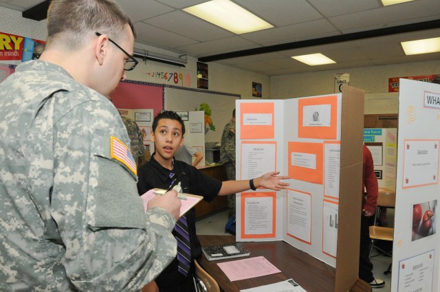 Soldiers judge science fair