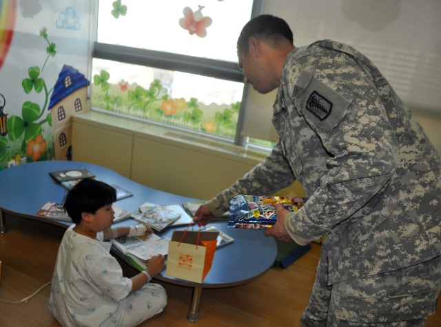 Servicemembers hand out warmth to young patients