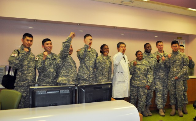 Servicemembers hand out warmth to young patients