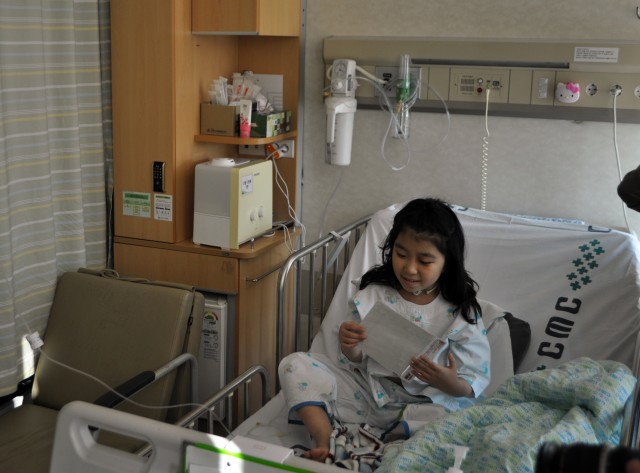Servicemembers hand out warmth to young patients