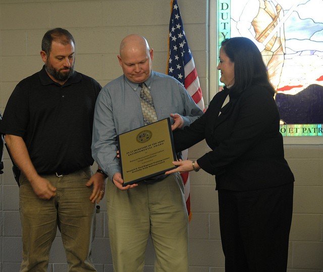 Assistant Secretary of the Army, Katherine Hammack presents the 2012 Natural Resources Conservation Award for large Army installations to staff members of the Wendell H. Ford Regional Training Center