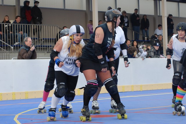 Zama's 'Killer Katanas' compete in 'Scar Wars' mash-up roller derby bout with special guest
