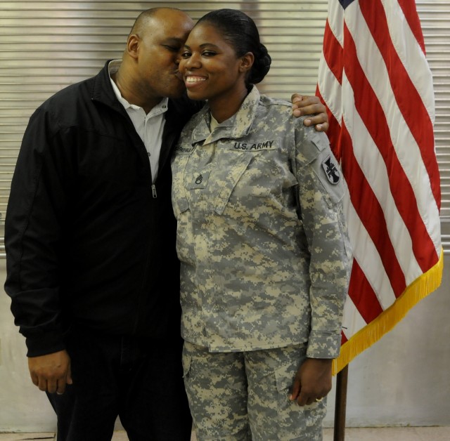 Jamaica-born Army Reserve Soldier reenlists, thanks spouse for support